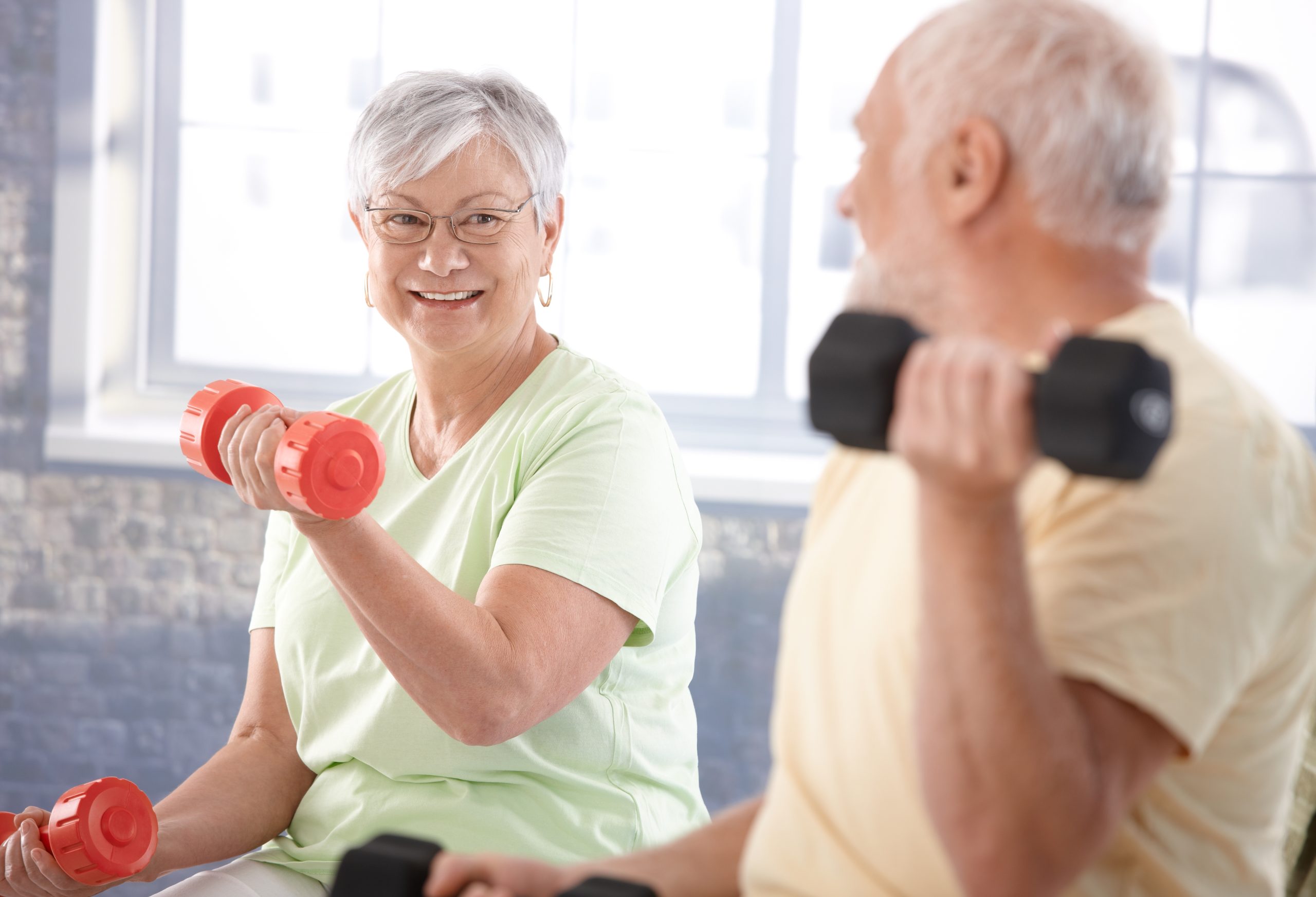 Vital senior couple in the gym