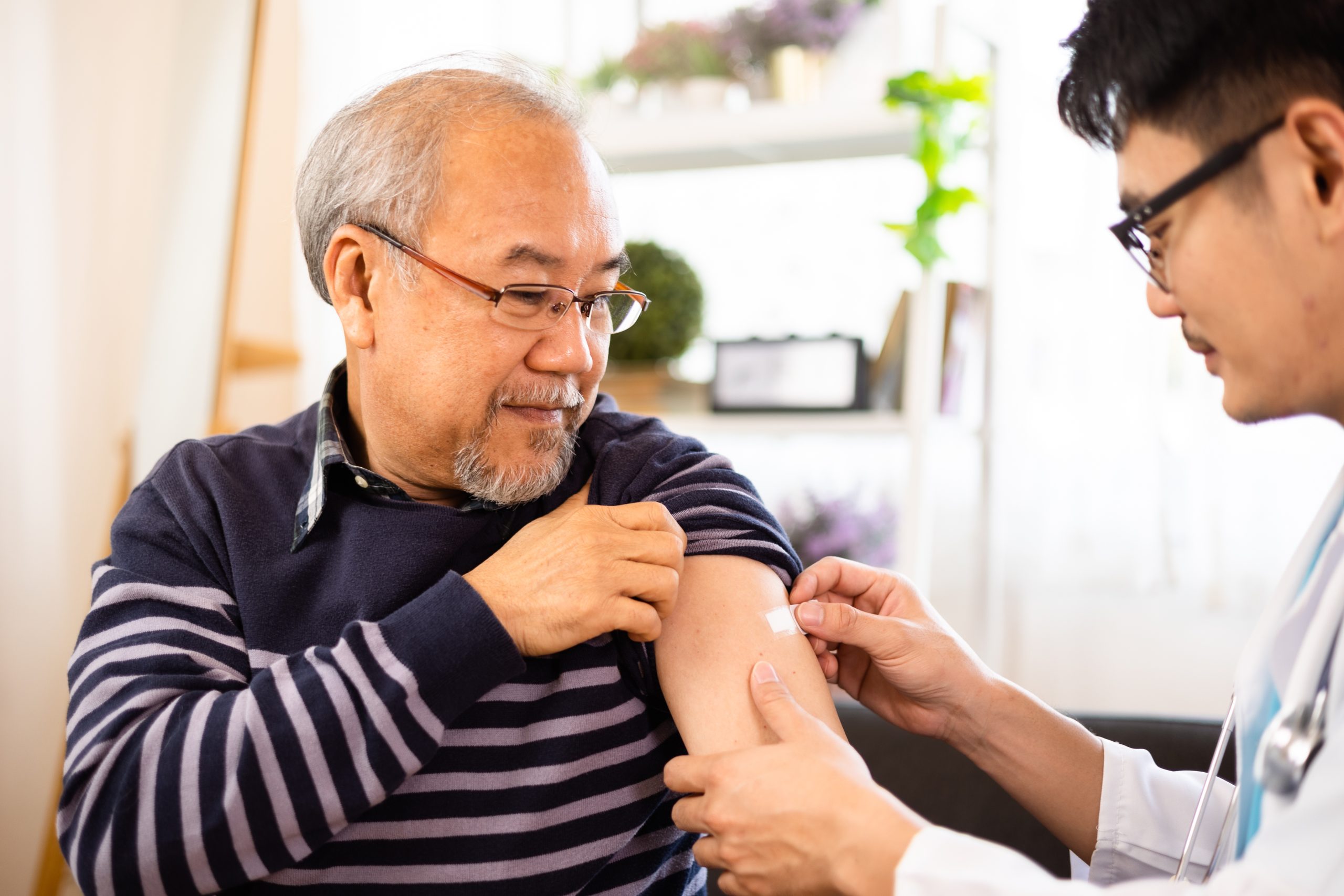 senior receiving flu shot