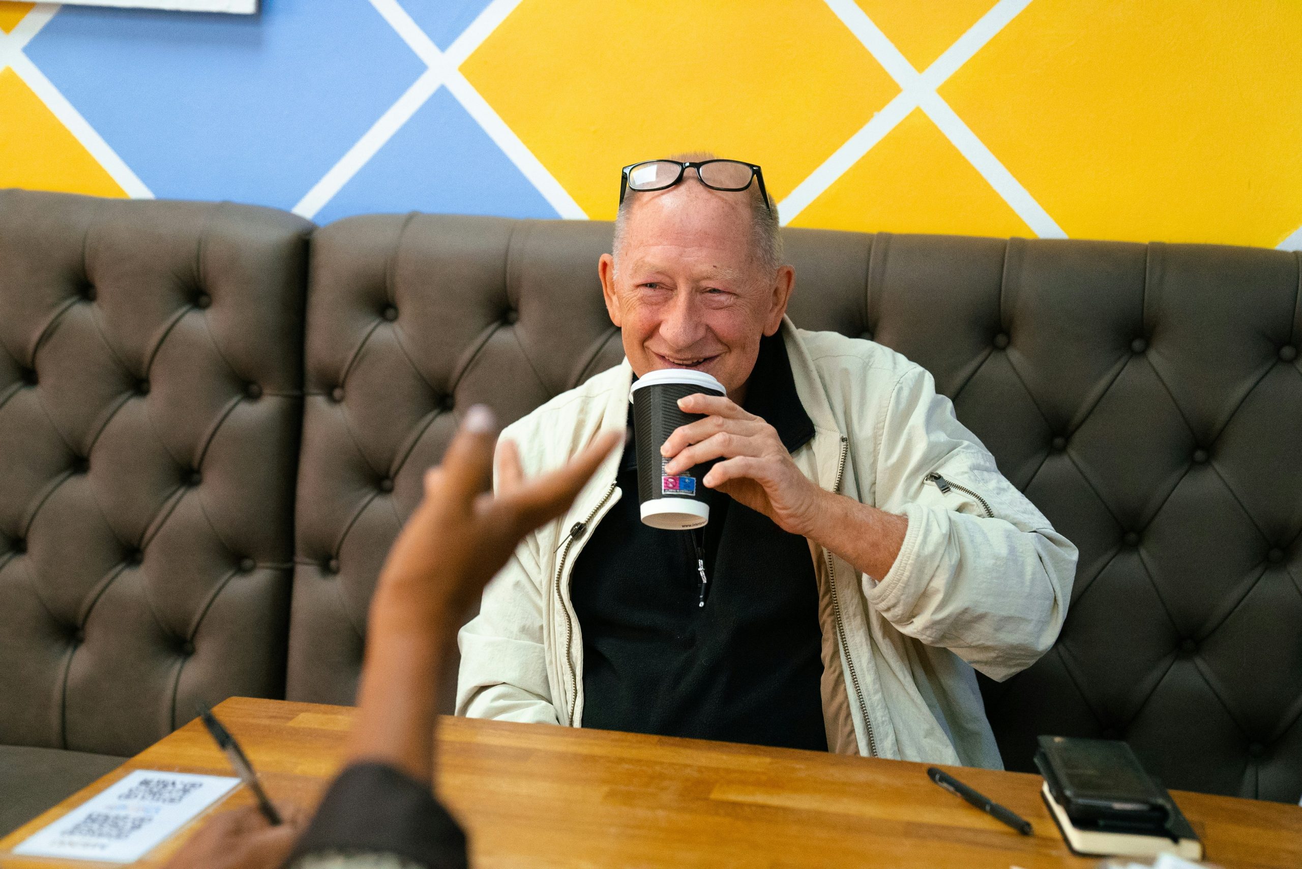 senior man drinking coffee smiling