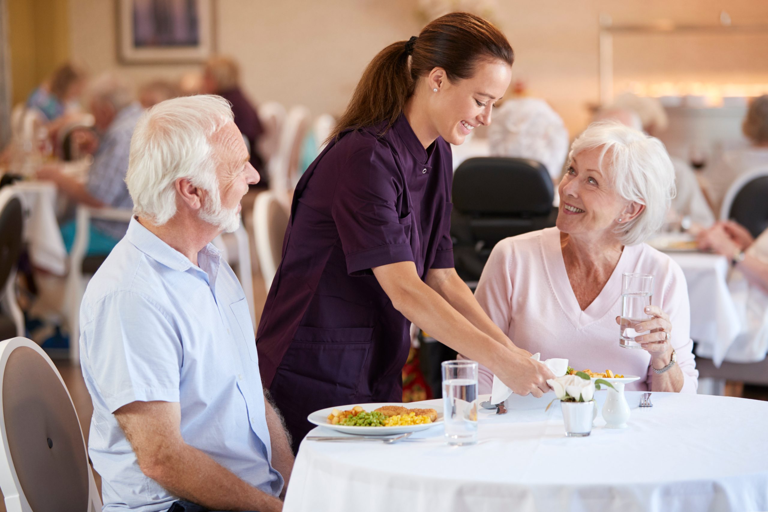 seniors enjoying a meal in a dining hall